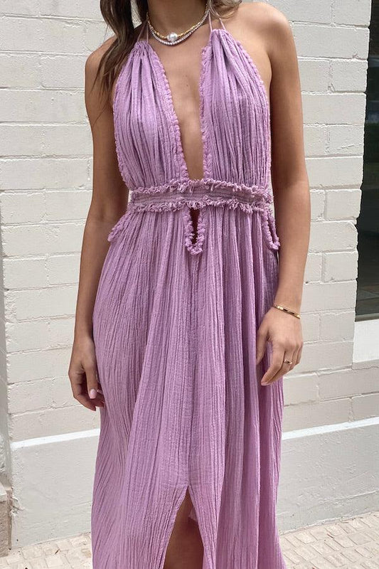 Lefkothea Dress Lilac by D’Artemide – A dreamy one-size cotton dress with halterneck, deep V, and low back, perfect for Sunday lunches or boat parties.