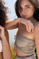 Ruched Tube Top Mocha by D’Artemide, Cotton tube top with ruched back and tie front, perfect for warm-weather layering or resort pairings.